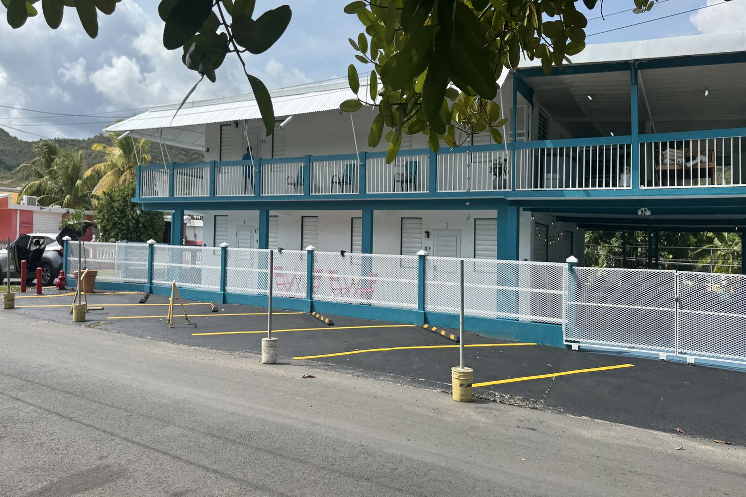 Gated entrance and covered ground-level area at La Sirena del Mar