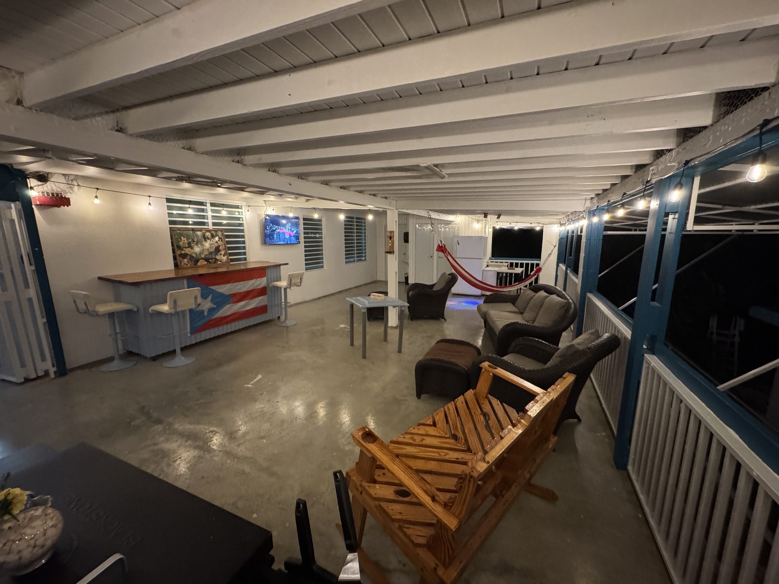 La Puesta del Sol — covered shared terrace with hammocks and seating